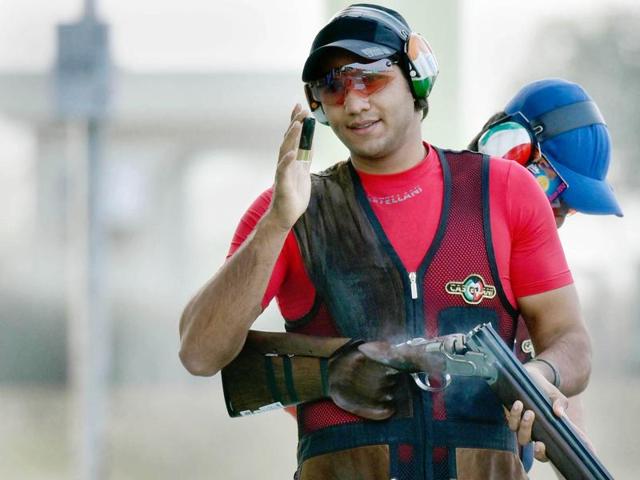 Indian shooter Kynan Chenai in action during trap shooting match in Asian Olympic Qualifying Competition at Dr Karni Singh Shooting Range in New Delhi.(Ravi Choudhary/HT Photo)