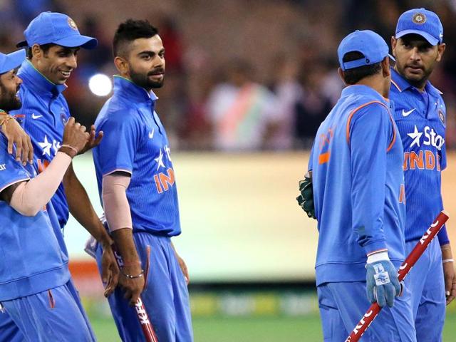 Indian teammates walk off after defeating Australia in their T20 cricket match in Melbourne. (AP Photo) Indian teammates walk off after defeating Australia in their T20 cricket match in Melbourne. (AP Photo)
