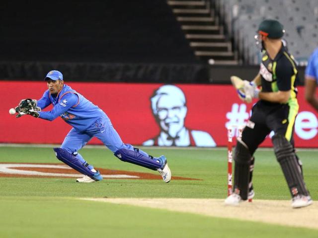 India's MS Dhoni moves to field during their T20 Match against Australia. (AP Photo) India's MS Dhoni moves to field during their T20 Match against Australia. (AP Photo)