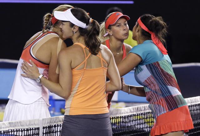 Martina Hingis, second left, of Switzerland and Sania Mirza, right, of India celebrate after defeating Czech Republic’s Andrea Hlavackova, second right, and Lucie Hradecka in the women's doubles final at the Australian Open tennis championships in Melbourne. (AP) Martina Hingis, second left, of Switzerland and Sania Mirza, right, of India celebrate after defeating Czech Republic’s Andrea Hlavackova, second right, and Lucie Hradecka in the women's doubles final at the Australian Open tennis championships in Melbourne. (AP)