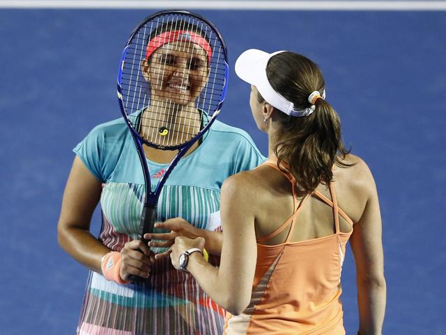 Martina Hingis, right, of Switzerland and Sania Mirza of India talk during their match. (AP) Martina Hingis, right, of Switzerland and Sania Mirza of India talk during their match. (AP)