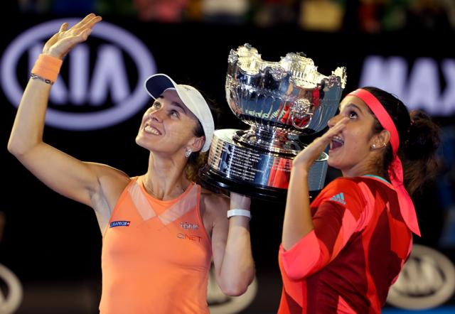 Martina Hingis, left, of Switzerland and Sania Mirza of India hold their trophy aloft after defeating Czech Republic’s Andrea Hlavackova and Lucie Hradecka in the women's doubles final. (AP) Martina Hingis, left, of Switzerland and Sania Mirza of India hold their trophy aloft after defeating Czech Republic’s Andrea Hlavackova and Lucie Hradecka in the women's doubles final. (AP)