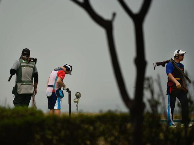 Shooters practice during the Asian Olympic Qualifying Competition at Dr Karni Singh Shooting Range. (Ravi Choudhary/HT Photo)
