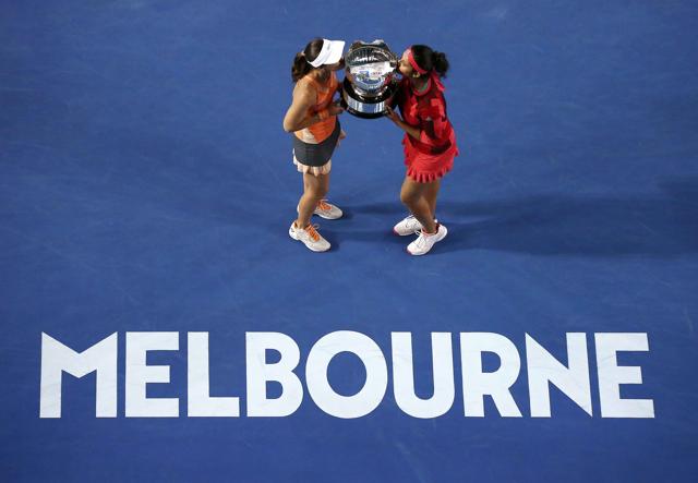 Switzerland's Martina Hingis (L) and India's Sania Mirza kiss the trophy after winning their doubles final match at the Australian Open tennis tournament at Melbourne Park. (REUTERS) Switzerland's Martina Hingis (L) and India's Sania Mirza kiss the trophy after winning their doubles final match at the Australian Open tennis tournament at Melbourne Park. (REUTERS)