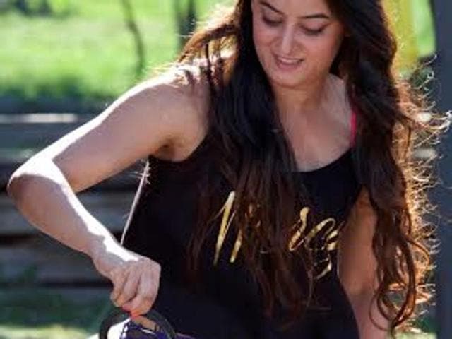 Participant Mahhi Vij deals with the snakes during a task on the show. (COLORS)