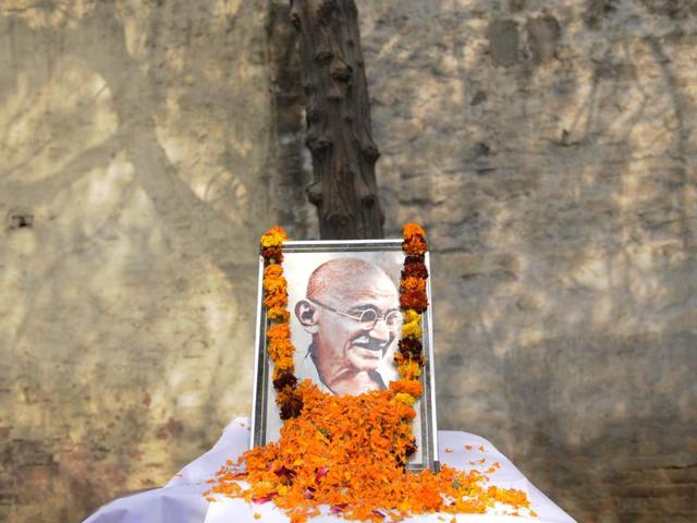A portrait of Indian Independence icon Mahatma Gandhi, on his 67th death anniversary at Congress office, in Noida. (Burhan Kinu/ HT Photo) A portrait of Indian Independence icon Mahatma Gandhi, on his 67th death anniversary at Congress office, in Noida. (Burhan Kinu/ HT Photo)