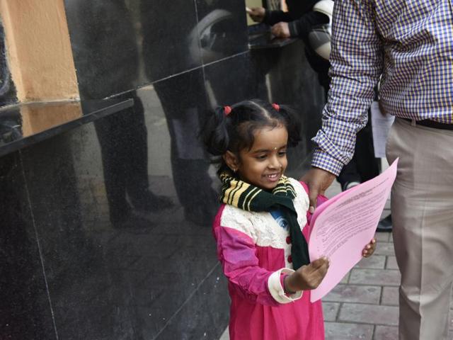 Parents buy admission forms for nursery for their children at a school in New Delhi. (Saumya Khandelwal/ HT photo) Parents buy admission forms for nursery for their children at a school in New Delhi. (Saumya Khandelwal/ HT photo)