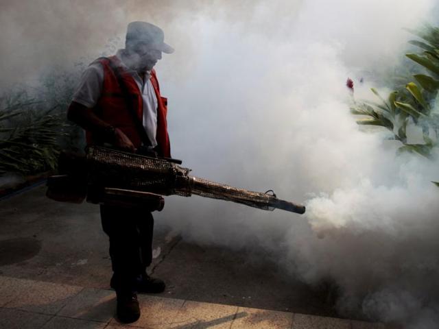City workers fumigate the Jardines de Merliot neighbourhood as part of preventive measures against the Zika virus and other mosquito-borne diseases in Santa Tecla, El Salvador. (REUTERS) City workers fumigate the Jardines de Merliot neighbourhood as part of preventive measures against the Zika virus and other mosquito-borne diseases in Santa Tecla, El Salvador. (REUTERS)