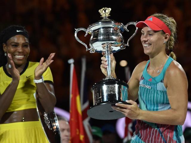Angelique Kerber holds the Daphne Akhurst Memorial Cup after her victory against Serena Williams.(AFP Photo)