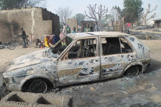 Children gather around a burnt out car following an attack by Boko Haram in Dalori village 5 kilometers (3 miles) from Maiduguri, Nigeria. (AP Photo) Children gather around a burnt out car following an attack by Boko Haram in Dalori village 5 kilometers (3 miles) from Maiduguri, Nigeria. (AP Photo)