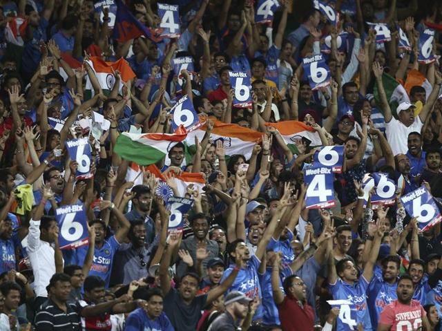Indian fans cheer and celebrate as batsmen Rohit Sharma hits a six during their T20 match. (AP Photo) 