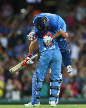 Suresh Raina on top celebrates with Yuvraj Singh of India after hitting a four last ball to win. (AFP Photo) 