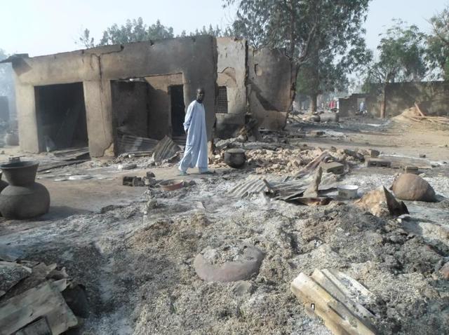 A man walks past burnt out houses following an attack by Boko Haram in Dalori village in Nigeria. (AP) A man walks past burnt out houses following an attack by Boko Haram in Dalori village in Nigeria. (AP)