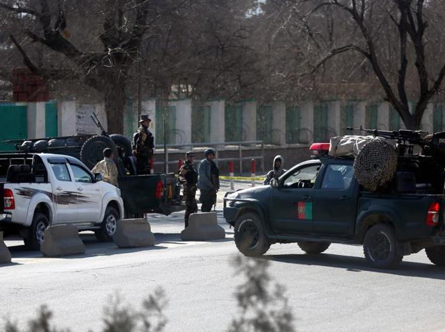Afghan security forces inspect the site of a suicide attack at the gate of a Civil Order Police compound, in Kabul, Afghanistan. (AP Photo) Afghan security forces inspect the site of a suicide attack at the gate of a Civil Order Police compound, in Kabul, Afghanistan. (AP Photo)