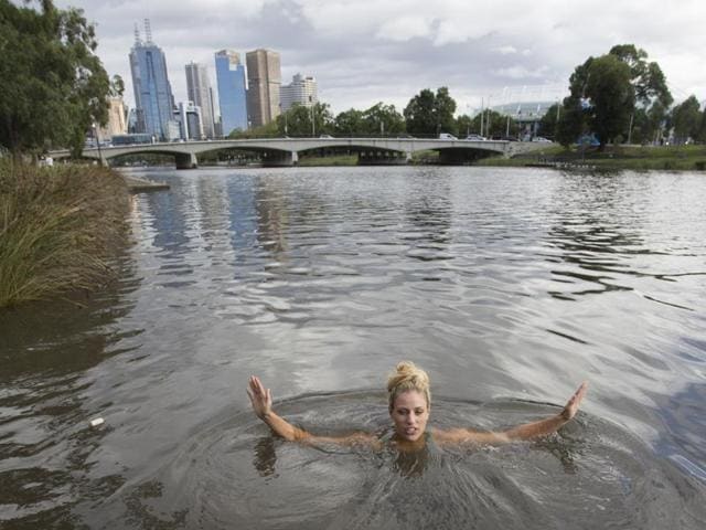 In this photo provided by Tennis Australia, Angelique Kerber of Germany swims in the Yarra River the morning after winning the Australian Open women's singles title.(AP)