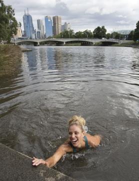 In this photo provided by Tennis Australia, Angelique Kerber of Germany reacts after swimming in the Yarra River. (AP)