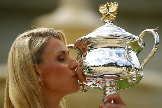 Germany's Angelique Kerber kisses the women's singles trophy a day after winning her final match at the Australian Open. (REUTERS)