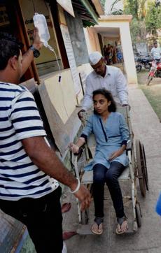 One of the college students rescued from drowning off the Murud-Janjira beach being treated at a hospital in Murud. (PTI) One of the college students rescued from drowning off the Murud-Janjira beach being treated at a hospital in Murud. (PTI)