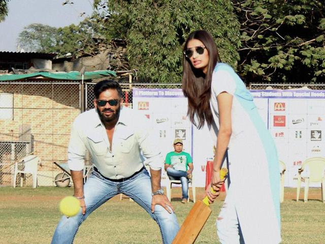 Meanwhile in Mumbai, Bollywood actor Suniel Shetty along with his daughter and actor Athiya Shetty during the Vishesh Cup cricket match of differently abled children. (PTI) 