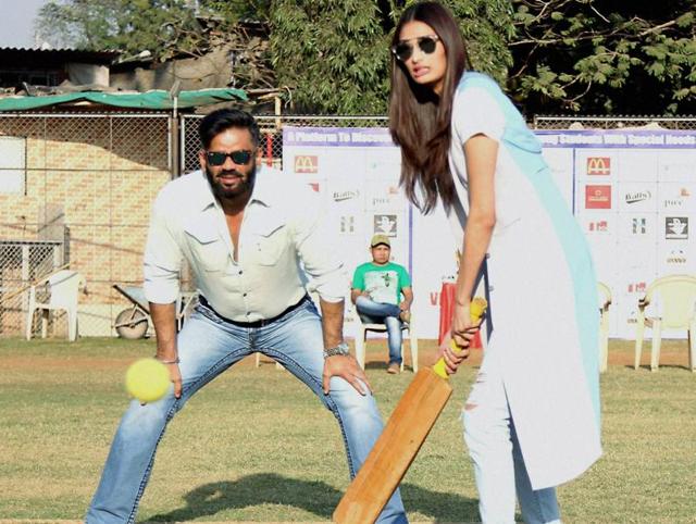 Suniel Shetty along with his daughter Athiya during the Vishesh Cup cricket match of differently abled children in Mumbai. (PTI) 