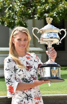Germany's Angelique Kerber poses with The Daphne Akhurst Memorial Trophy as she celebrates her victory. (AFP)
