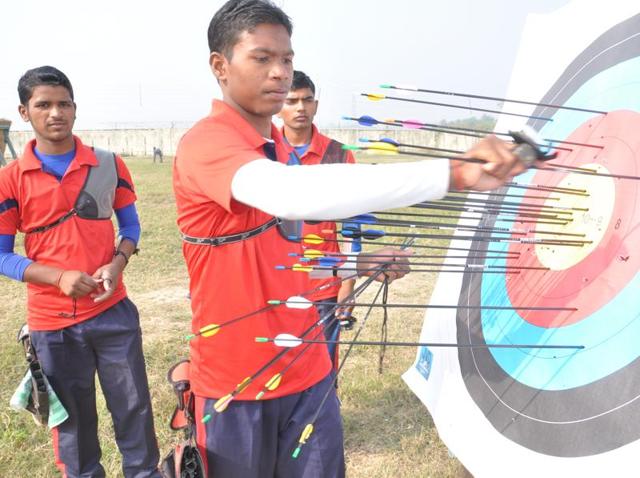 Coach Ashok Yadav instructs archers during a training session at the Robertsganj centre. (Rajesh Kumar/HT Photo) Coach Ashok Yadav instructs archers during a training session at the Robertsganj centre. (Rajesh Kumar/HT Photo)