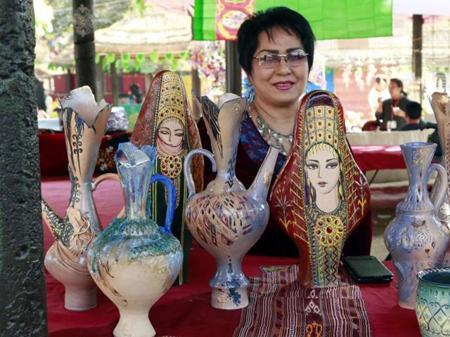 An artist from Turkmenistan showcasing her ceramic works at Surajkund Mela near Faridabad on Tuesday. (HT photo)