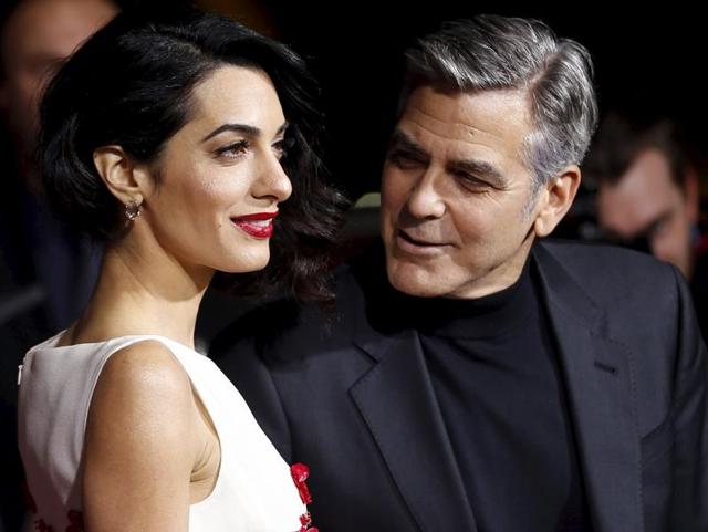 Needless to say George Clooney was handsome as ever but all eyes were on his barrister wife (even his own).   (REUTERS) 