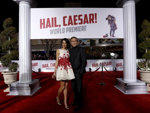 Amal wore a beautiful red and white mini dress by Giambattista Valli.  (REUTERS) 