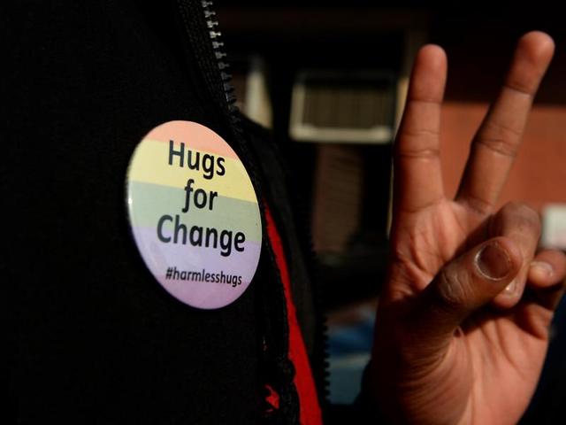 A member of the LGBT community shows a victory sign outside the Supreme Court after the court agreed to review a law outlawing gay sex. (AFP) A member of the LGBT community shows a victory sign outside the Supreme Court after the court agreed to review a law outlawing gay sex. (AFP)