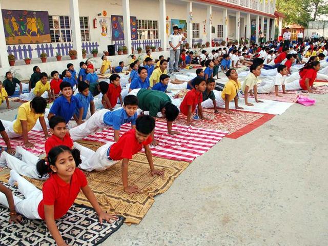 Schoolchildren participate in a yoga class in Mirzapur, Uttar Pradesh. All India Muslim Personal Law Board member Maulana Sajjad Nomani has accused the BJP-led NDA government of “thrusting” the “Hindutva” on citizens.(File Photo) Schoolchildren participate in a yoga class in Mirzapur, Uttar Pradesh. All India Muslim Personal Law Board member Maulana Sajjad Nomani has accused the BJP-led NDA government of “thrusting” the “Hindutva” on citizens.(File Photo)