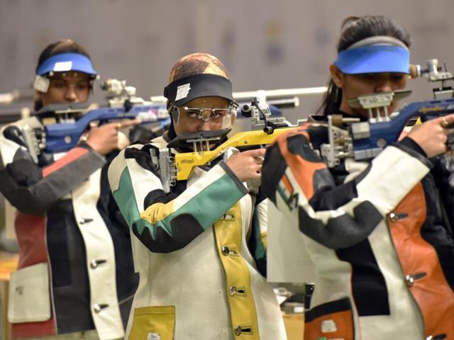 Iranian shooter Khedmati Najmeh (center ) getting ready to take her shoot in 10 m air Rifle Shooting in Asian Olympic Qualifying Competition. (HT Photo) 