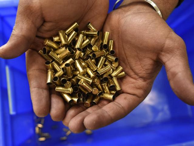 Used rounds from the 10m air pistol event, shown by an official at the Karni Singh range. (HT Photo) 