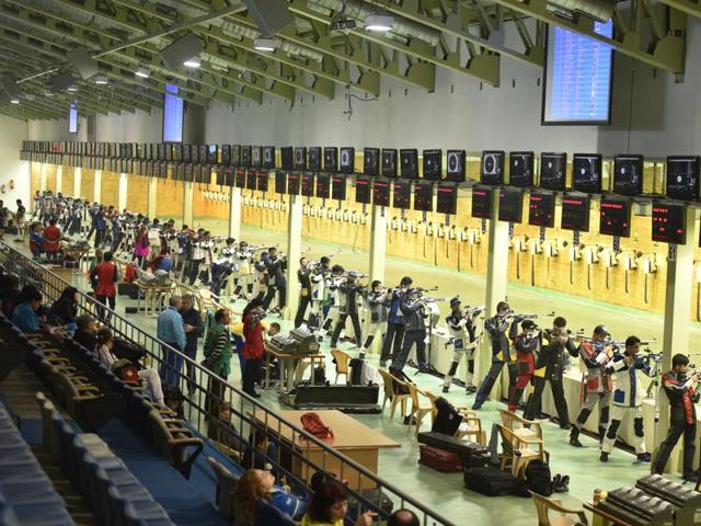 Shooters practising during the Asian Olympic Qualifying Competition at Dr Karni Singh Shooting Range in New Delhi. (HT Photo) 