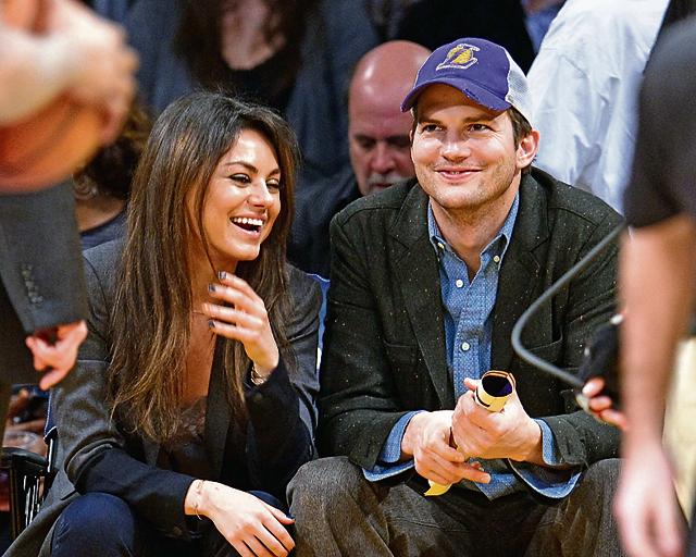 Ashton Kutcher and Mila Kunis attend a basketball game between the Utah Jazz and the Los Angeles Lakers at Staples Center on January 3, 2014 in Los Angeles, California. (Getty Images)