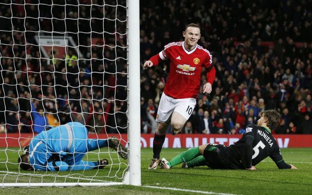 Wayne Rooney celebrates scoring the third goal for Manchester United. (Reuters Photo)