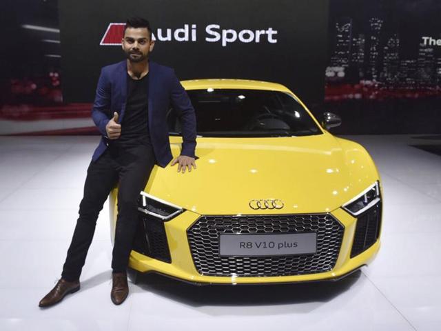 Virat Kohali poses next to Audi R8v10 Plus during its launch. (Ravi Choudhary/HT)