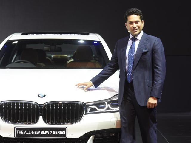 Sachin Tendulkar stands next to BMW 7-Series on its launch at Auto Expo 2016. (Mohd Zakir/HT)