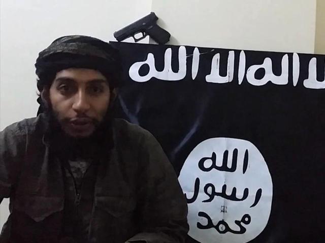 An image grab taken from a video released by the jihadist media arm al Hayat Media Centre purportedly shows suspected Paris attacks mastermind Abdelhamid Abaaoud speaking to the camera at an undisclosed location.(AFP Photo)