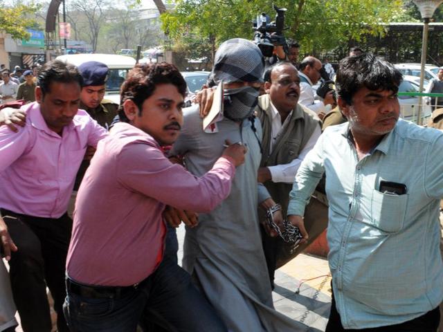 Alleged Islamic State operative Azhar Iqbal produced at district court on Tuesday afternoon who was arrested by NIA team on Monday evening in Bhopal. (Praveen Bajpai/ Hindustan Times) Alleged Islamic State operative Azhar Iqbal produced at district court on Tuesday afternoon who was arrested by NIA team on Monday evening in Bhopal. (Praveen Bajpai/ Hindustan Times)