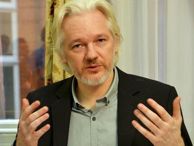Wikileaks founder Julian Assange has said he will turn himself over to the police on Friday if a UN panel rules he has not been unlawfully detained.