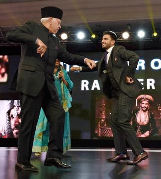 Former Union minister Farooq Abdullah dances with Ranveer at the NDTV Indian of the Year Awards function in New Delhi. (PTI)
