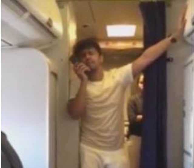 Video grab of Sonu Nigam singing on-board a flight.