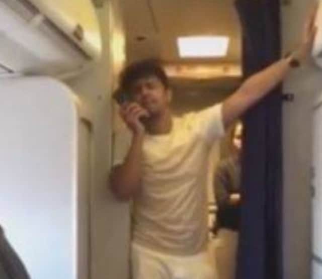 An online grab of Sonu Nigam performing while aboard a flight to Mumbai.