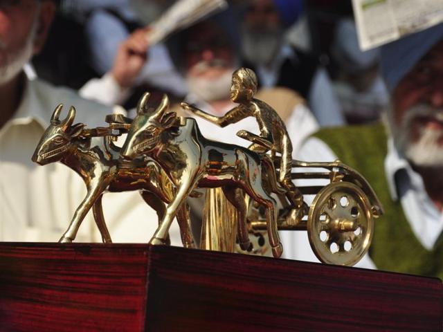 STILL PRESENT: Even though bullock-cart races are not happening at the Kila Raipur Rural games for the second year running due to a ban, the marquee event has a ‘golden’ presence at the event in the form of this trophy. (Sikander Singh Chopra/HT Photo)