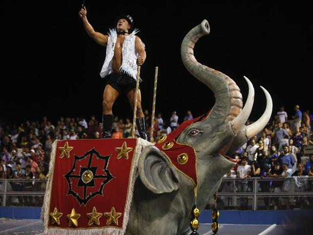 A dancer from the Nene de Vila Matilde samba school performs on a float during a carnival parade in Sao Paulo, Brazil.  (AP) 