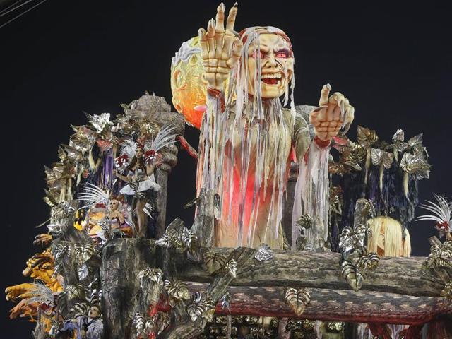Dancers from the Gavioes da Fiel samba school perform on a float during a carnival parade in Sao Paulo, Brazil.  (AP) 