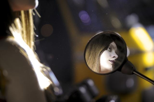 A model at the auto event is reflected in the rear view mirror of a motorbike. (Sunil Ghosh/ HT photo) A model at the auto event is reflected in the rear view mirror of a motorbike. (Sunil Ghosh/ HT photo)