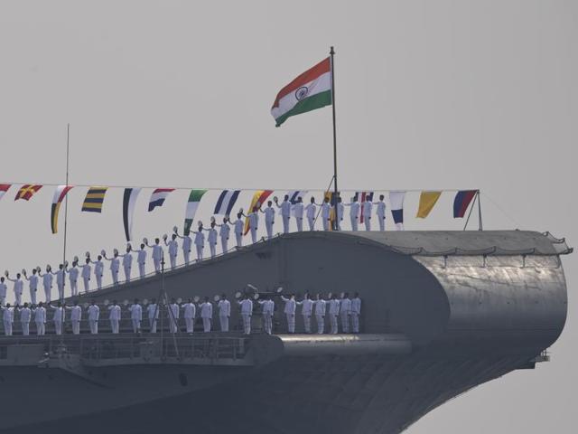 Indian sailors aboard the India’s second aircraft carrier Viraat, line up to salute the Indian President Pranab Mukherjee, during the International Fleet Review in Vishakapatnam. (AP Photo)