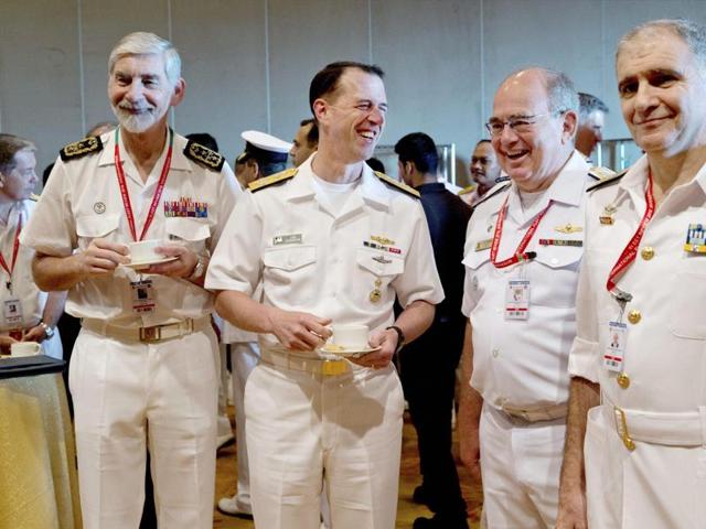 US chief of naval operations John Richardson, second left, shares a laugh with Portuguese chief of navy Luís Macieira Fragoso, left, Brazilian Navy commander Eduardo Bacellar Leal Ferreira, second right, and an unidentified naval officer during the International Fleet Review in Vishakapatnam. (PTI Photo)
